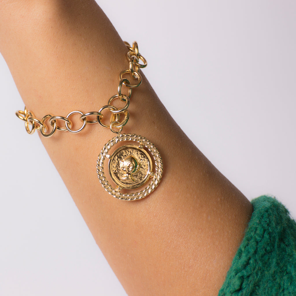 Medaglia dorata - Pomidèfiure e Caravella con ghiera